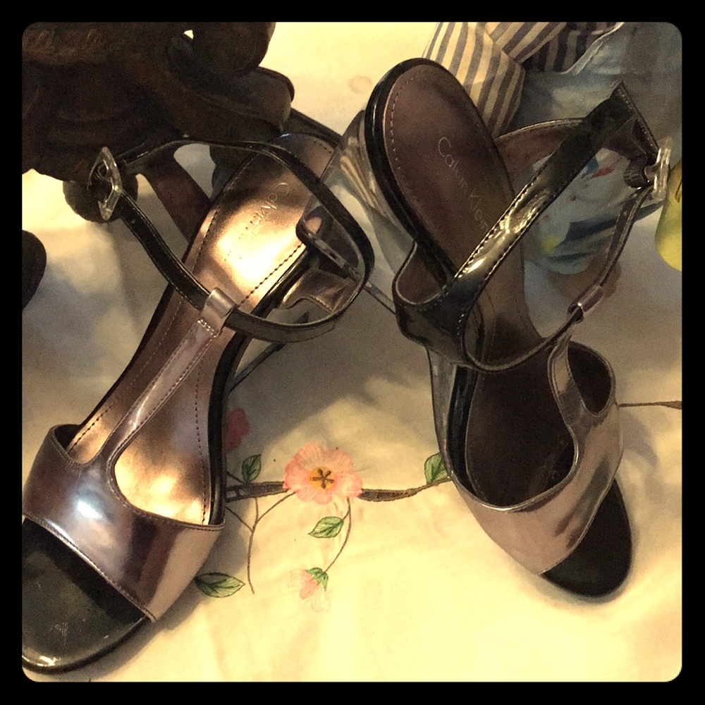 black and silver sandal see-through acrylic heel.